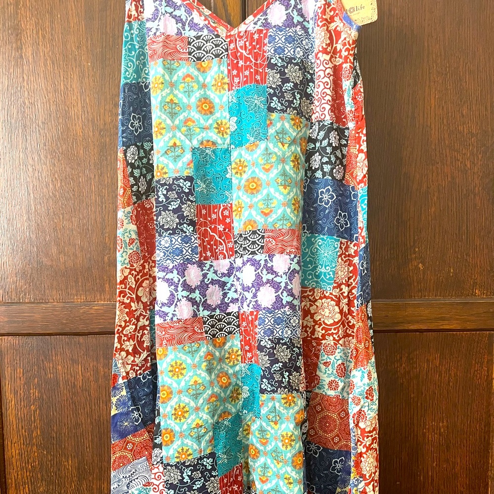 Beautiful v-neckline easy slip on patch work print dress! Great for travel!
